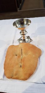 Bread and wine on an altar.
